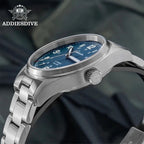ADDIESDIVE AD2070 automatic field watch with blue dial showing bright cyan luminous Arabic numerals and hands in dark