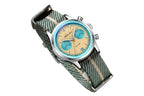 ADDIESDIVE AD2095 quartz chronograph with beige panda dial, teal sub-registers and green-beige NATO strap, angled view