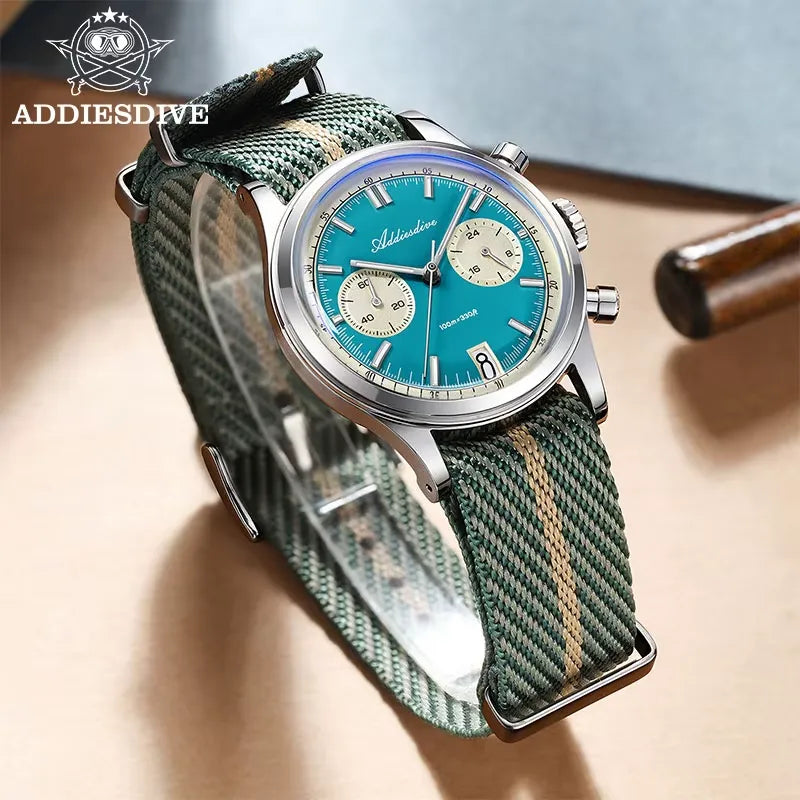 ADDIESDIVE AD2095 quartz chronograph with teal dial, cream sub-registers and green-beige NATO strap, lifestyle shot on wood