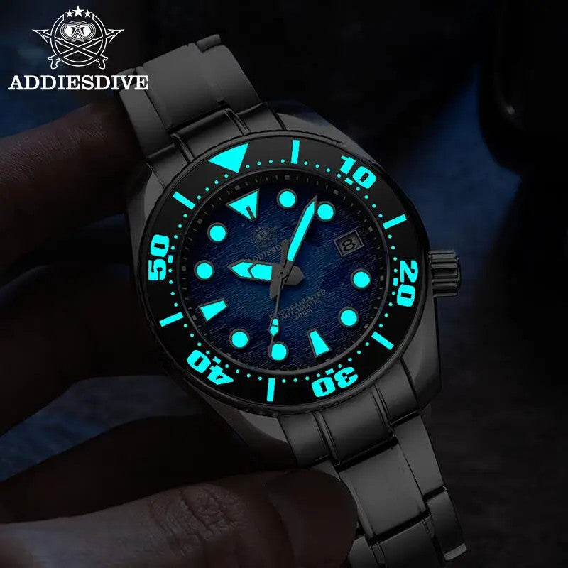 ADDIESDIVE AD2102 NH35 automatic dive watch with blue dial showing bright cyan luminous hands and markers held in hand