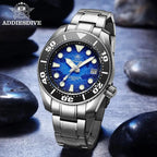 ADDIESDIVE AD2102 NH35 automatic dive watch with blue wave dial and steel bracelet, lifestyle shot on dark stones