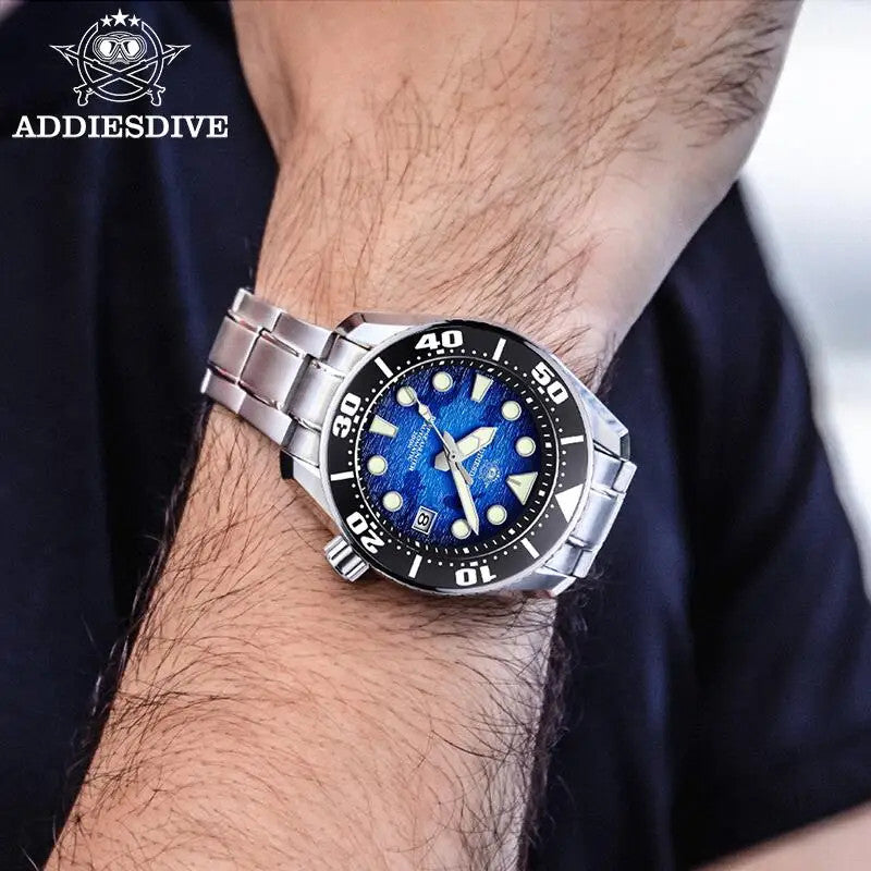 ADDIESDIVE AD2102 NH35 automatic dive watch with blue wave dial and steel bracelet, lifestyle shot with blue backdrop