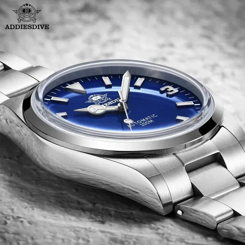 ADDIESDIVE AD2112 automatic Explorer-style with blue dial side profile on wooden surface showing polished case and steel