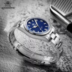 ADDIESDIVE AD2112 automatic Explorer-style with blue dial and steel bracelet, lifestyle shot on rough surface