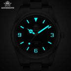 ADDIESDIVE AD2112 automatic Explorer-style showing bright cyan luminous hands, Arabic numerals and markers in dark