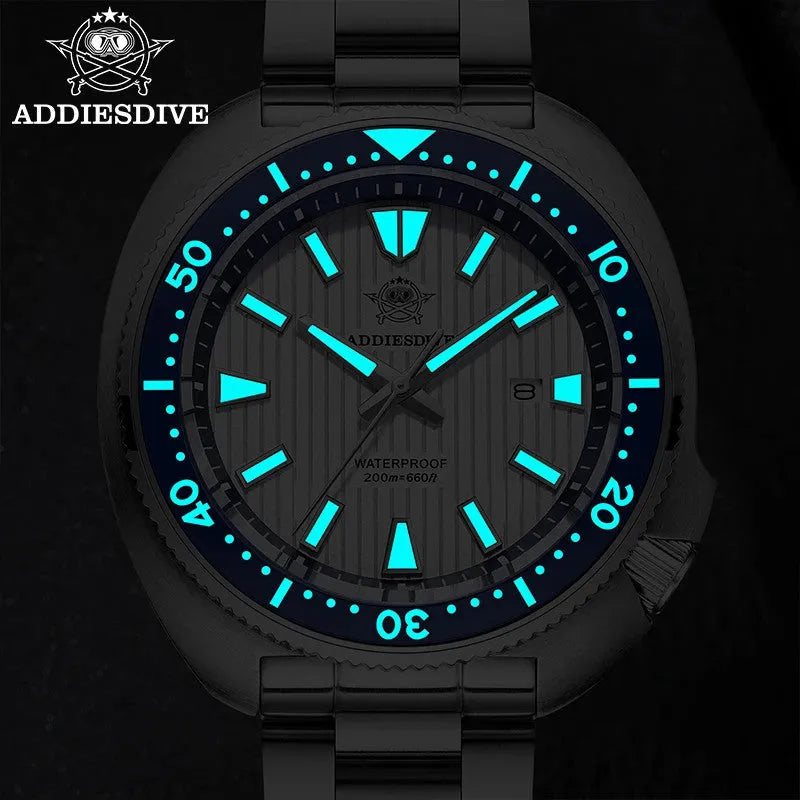 ADDIESDIVE AD2507 quartz diver watch lume glow detail with cyan luminous markers in darkness