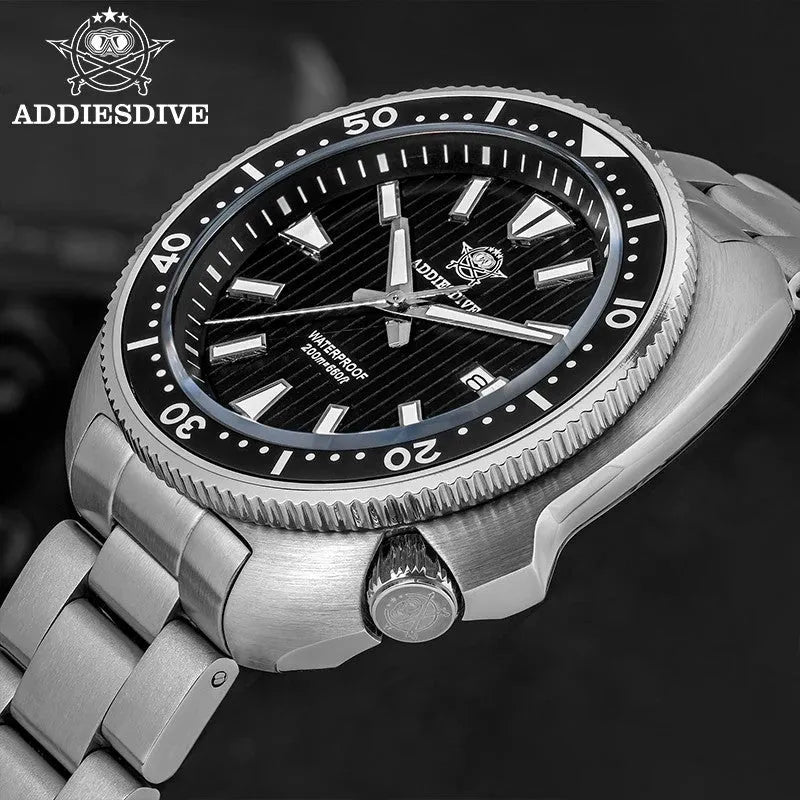 ADDIESDIVE AD2507 turtle-style diver quartz with black fluted dial and steel bracelet, angled lifestyle shot