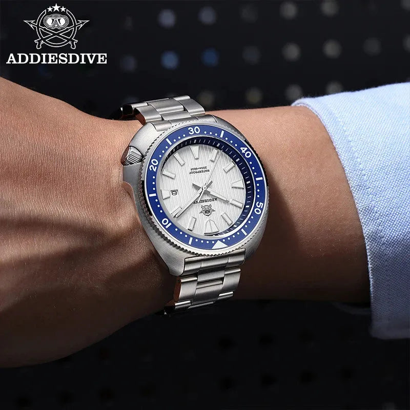 ADDIESDIVE AD2507 turtle-style diver quartz with white fluted dial and blue bezel, shown on wrist