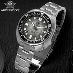 ADDIESDIVE AD2511 turtle-style diver quartz angled close-up of grey fluted dial with engraved crown and steel bracelet