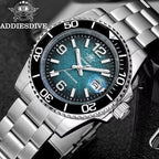 ADDIESDIVE AD2513 Diver's 200M quartz with teal dial and steel bracelet, angled lifestyle shot on tile