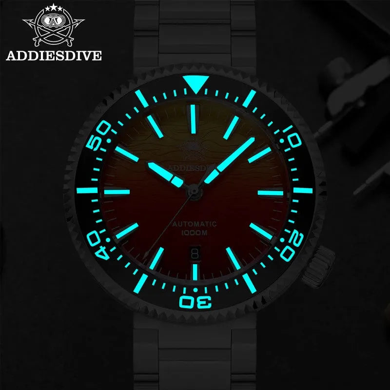 ADDIESDIVE AD2526 1000M automatic dive watch with red dial showing bright cyan luminous hands and markers in dark