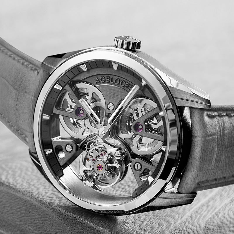 Agelocer 3D-Manta flying tourbillon watch angled close-up on leather, silver case and grey suede strap
