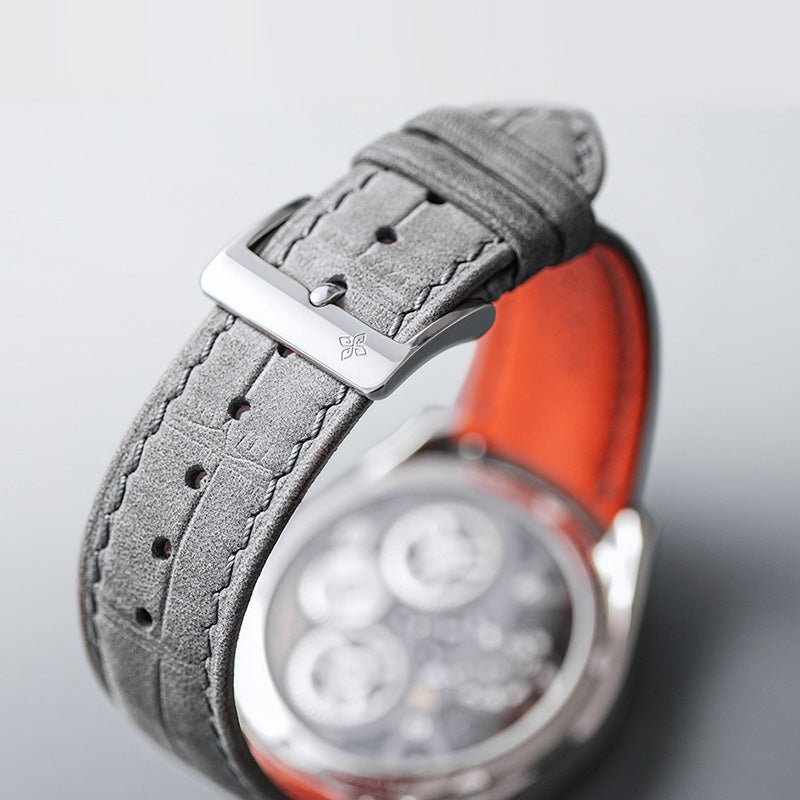 Agelocer 3D-Manta tourbillon watch grey suede strap with signature buckle and orange lining, close-up detail