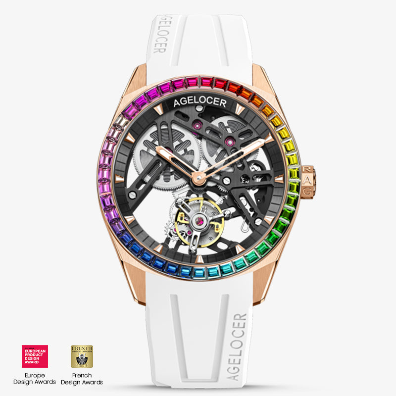 Agelocer rainbow tourbillon watch, rose gold case, black skeleton dial, gem-set rainbow bezel, white strap