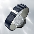 Rose gold caseback of Agelocer Baikal Happy Diamond watch with edelweiss engraving and blue leather strap