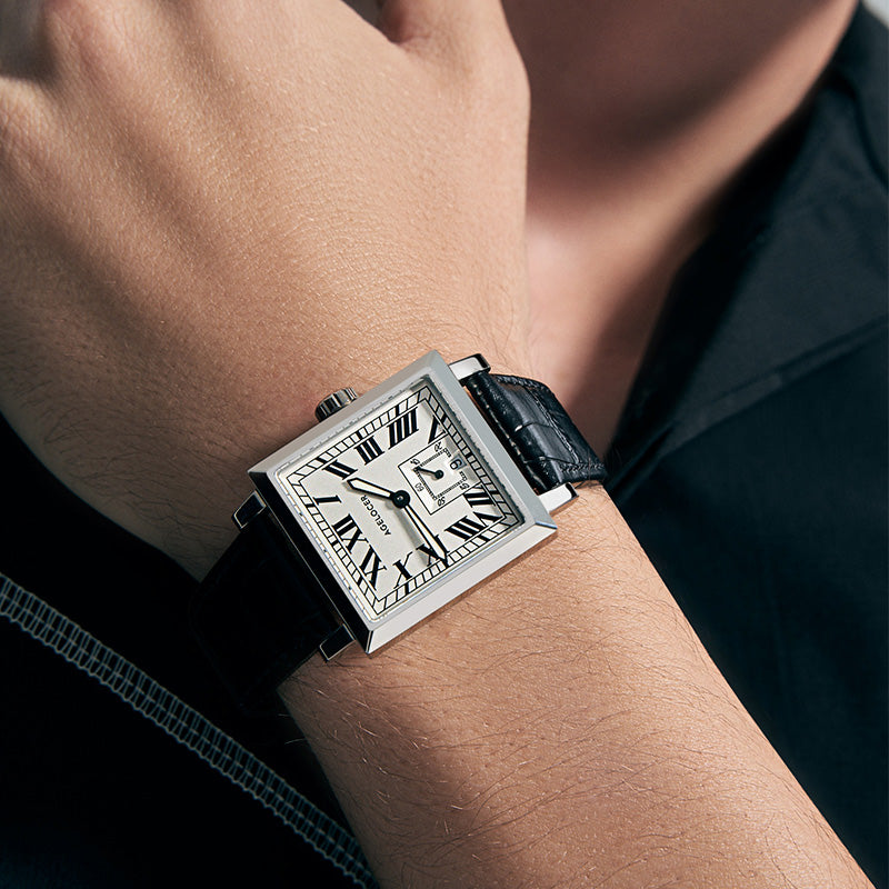 Agelocer Codex square automatic watch with white Roman dial worn on the wrist, close-up view