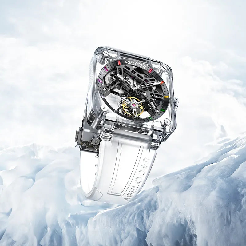 Agelocer transparent crystal tourbillon watch with black skeleton movement resting on ice, lifestyle shot