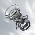 Exploded view of Agelocer Schwarzwald double-sided skeleton watch crystal, dial and movement