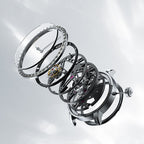 Exploded view of Agelocer free-sprung diamond tourbillon watch showing crystal, diamond bezel and movement