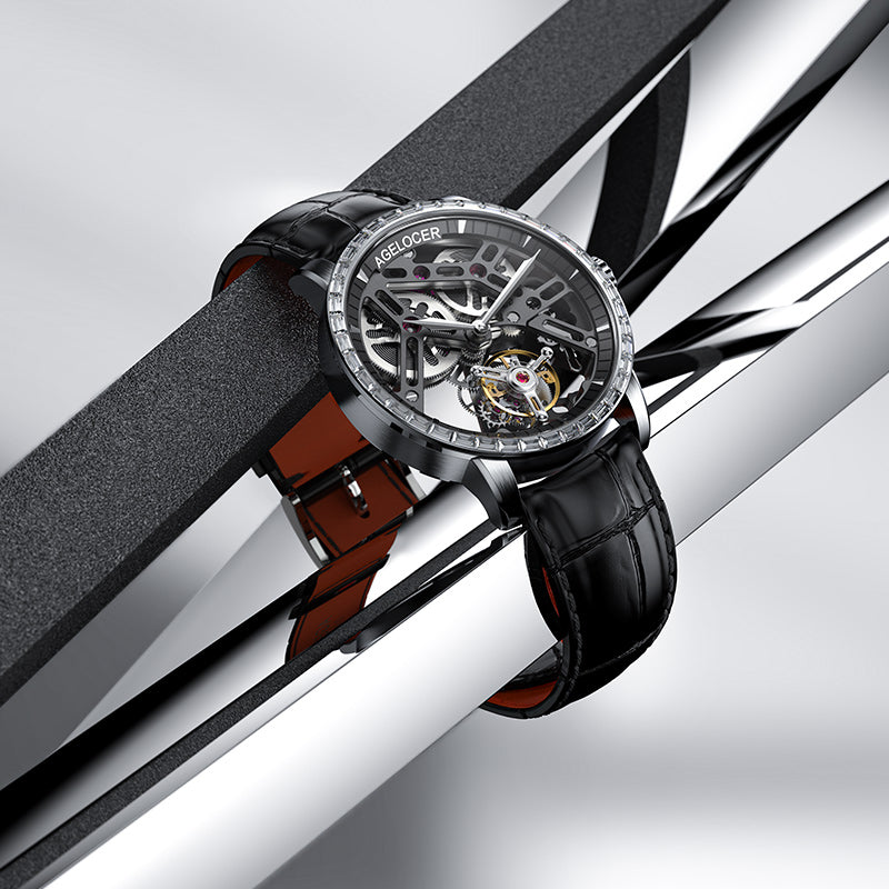 Agelocer free-sprung diamond tourbillon watch, black skeleton dial, resting on polished steel rails, product shot