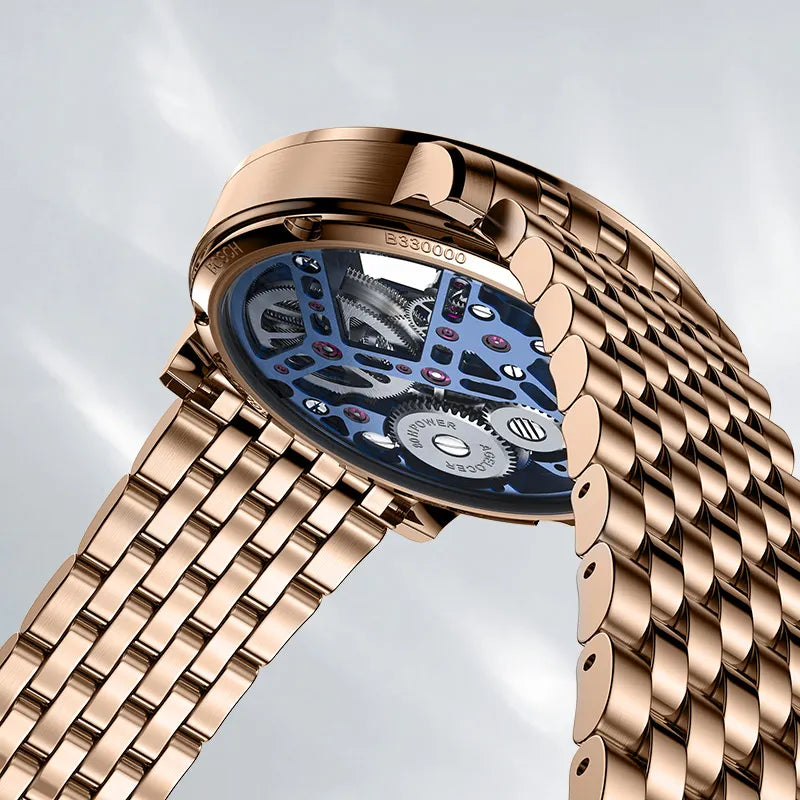 Caseback of Agelocer Free-Sprung skeleton tourbillon watch showing rose gold case and steel bracelet, close-up