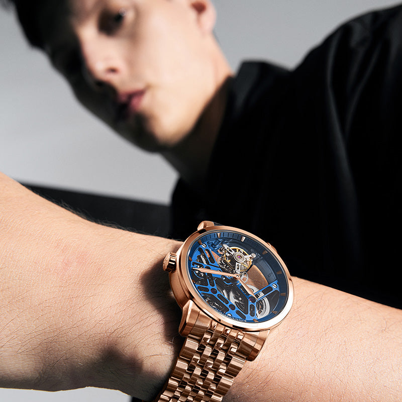 Agelocer Free-Sprung skeleton tourbillon watch with blue dial worn on the wrist, close-up lifestyle shot