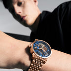 Agelocer Free-Sprung skeleton tourbillon watch with blue dial worn on the wrist, close-up lifestyle shot