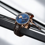 Agelocer Astronomer Galaxy rose gold moonphase watch staged on polished steel bars