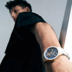 Man wearing Agelocer hollow tourbillon watch with white rubber strap, studio lifestyle shot