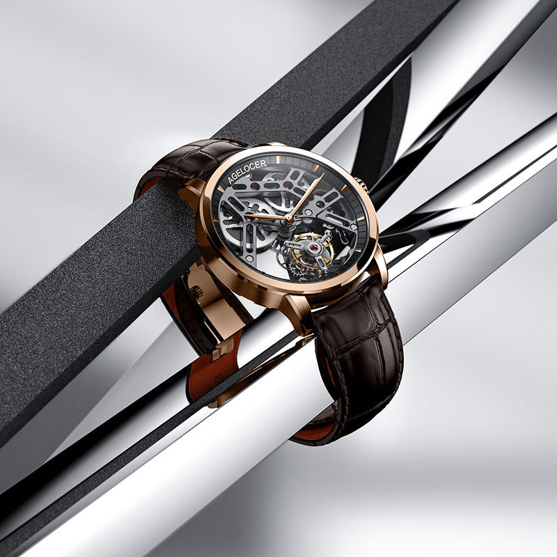 Agelocer manual tourbillon watch with black skeleton dial resting on polished steel bars, lifestyle shot