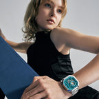 Female model wearing Agelocer Racing Fast & Furious women's teal watch, studio portrait lifestyle shot