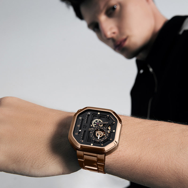 Man wearing Agelocer Racing Square rose gold automatic skeleton watch on steel bracelet, wrist lifestyle