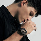 Man wearing Agelocer Racing Square automatic skeleton watch on black leather strap, wrist lifestyle view