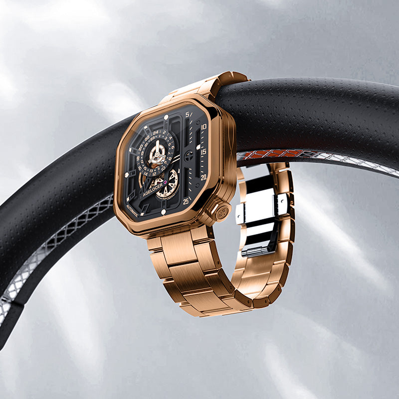 Agelocer Racing Square rose gold skeleton watch resting on a car steering wheel, racing lifestyle shot