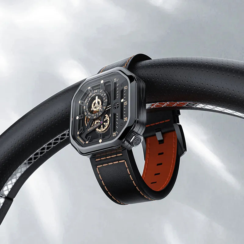 Agelocer Racing Square skeleton watch on a black leather strap resting on a car steering wheel, lifestyle