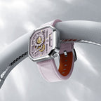 Agelocer Racing women's pink watch resting on a car steering wheel, racing lifestyle shot
