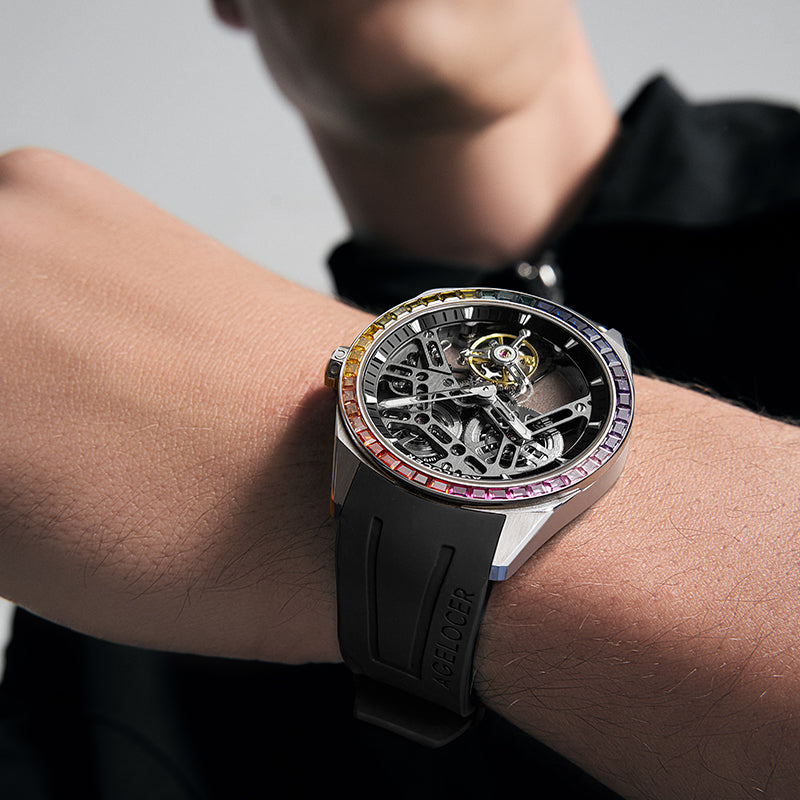 Male model wearing Agelocer Rainbow flying tourbillon watch with rainbow bezel, studio lifestyle shot