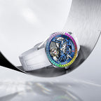 Agelocer rainbow bezel tourbillon watch with blue skeleton dial resting on a curved steel surface, lifestyle