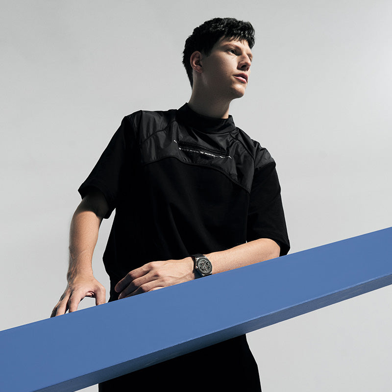 Male model wearing Agelocer Schwarzwald skeleton automatic watch, studio lifestyle shot