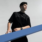Male model wearing Agelocer Schwarzwald skeleton automatic watch, studio lifestyle shot