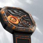 Close-up of Agelocer Volcano orange carbon fibre case and flame skeleton dial with luminous markers
