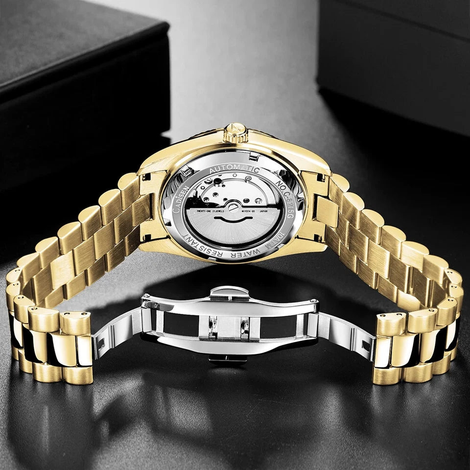 CADISEN C8214 gold watch exhibition case back showing automatic movement with gold and silver two-tone oyster bracelet on dark surface