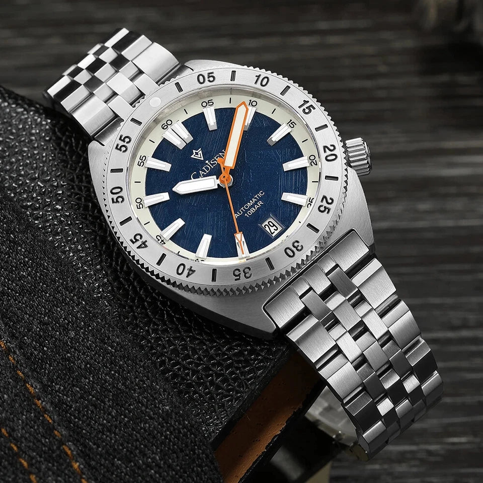 CADISEN C8231 automatic watch with blue dial and orange second hand, stainless steel case and bracelet on black textured surface