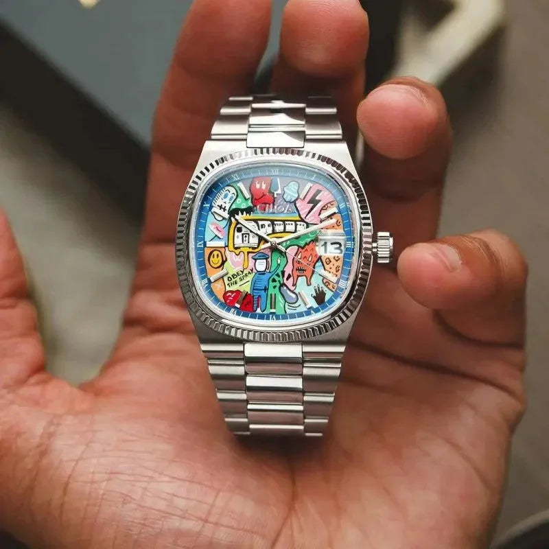Ciloa men's painted dial watch with multicolor graffiti dial and steel bracelet held in hand tilted view