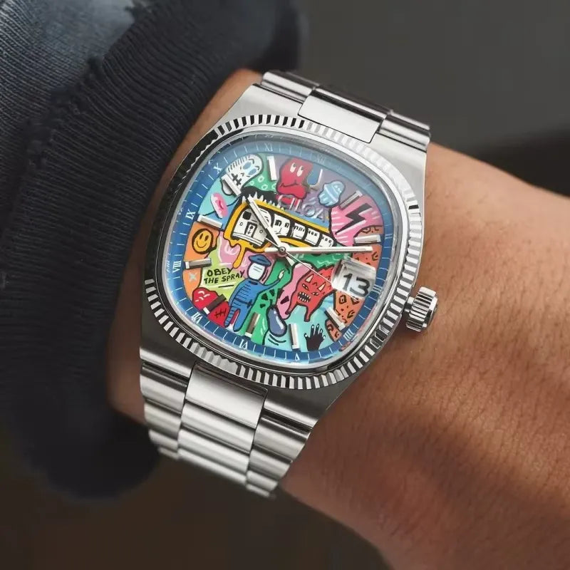 Ciloa painted dial watch with graffiti dial worn on wrist with navy sleeve