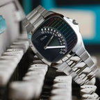 CILOA retro square quartz with black dial and rainbow scale resting on vintage typewriter