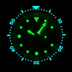 Close-up lume shot of the STEELDIVE SD1975N dial and bezel glowing in the dark