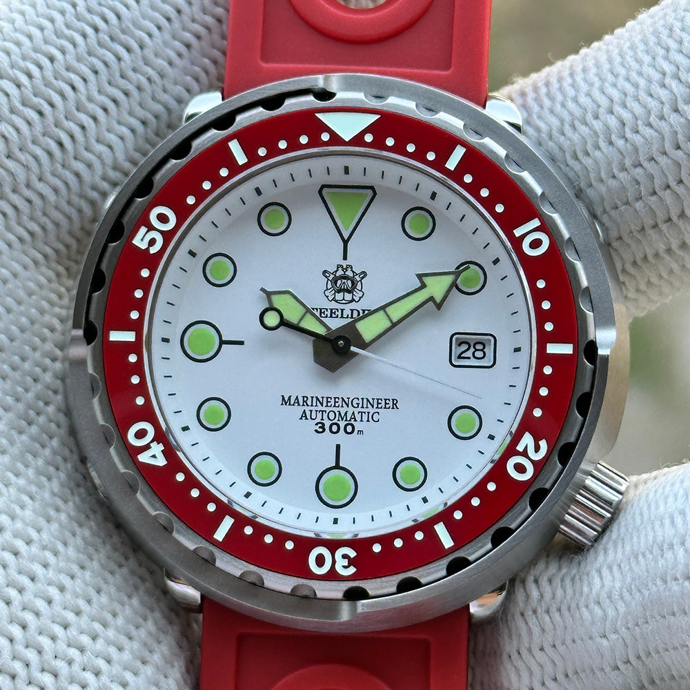 Close-up of the STEELDIVE SD1975N white dial with red bezel, marked Marineengineer Automatic 300m