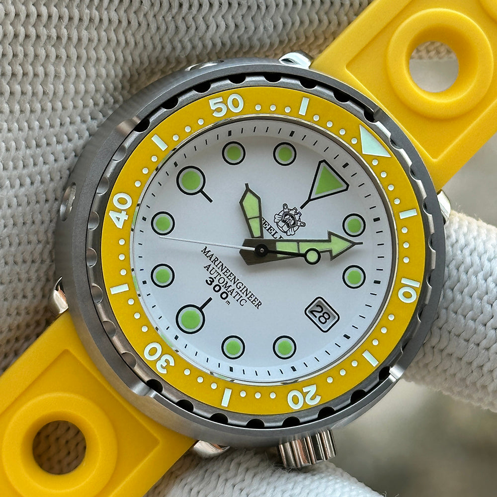 Close-up of the STEELDIVE SD1975N white dial with yellow bezel on a yellow rubber strap