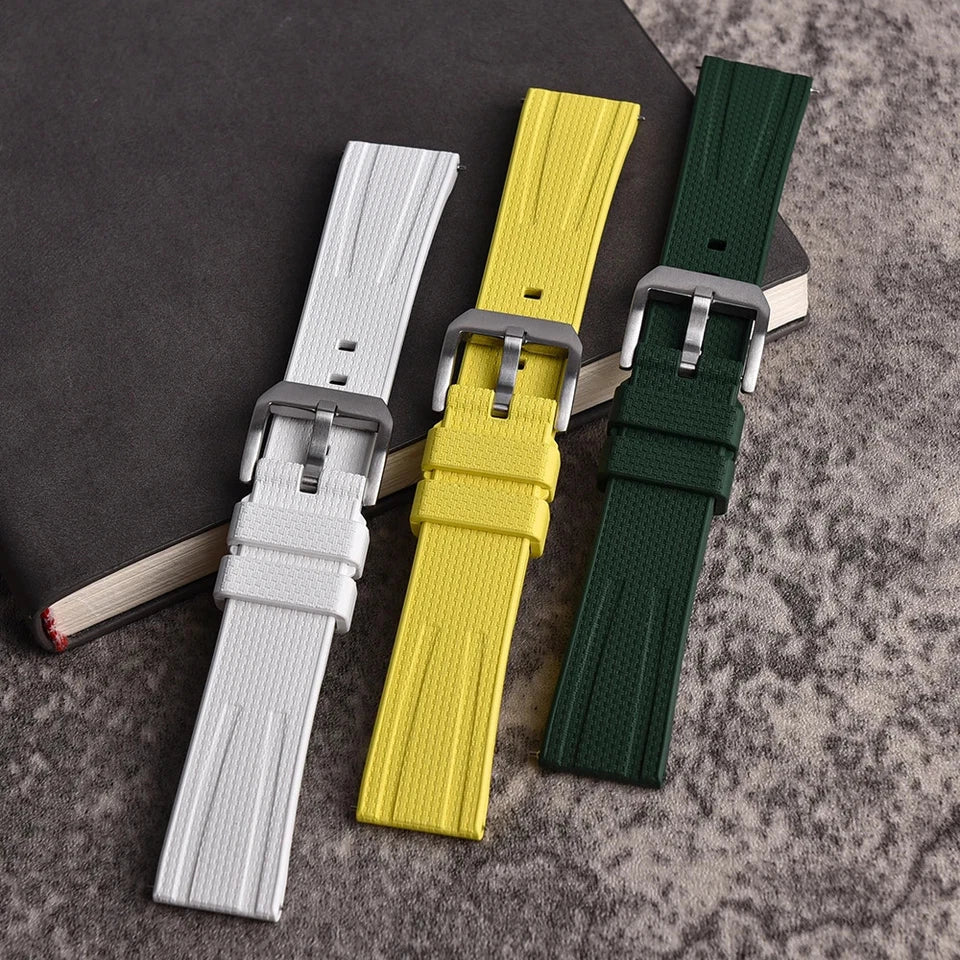 Fluororubber watch straps in white, yellow and dark green with silver pin buckles, comparison view